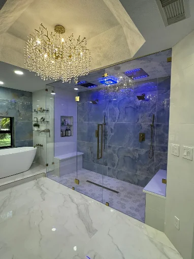 Art Lego LLC bathroom remodel with marble tile and glass shower — South Florida
